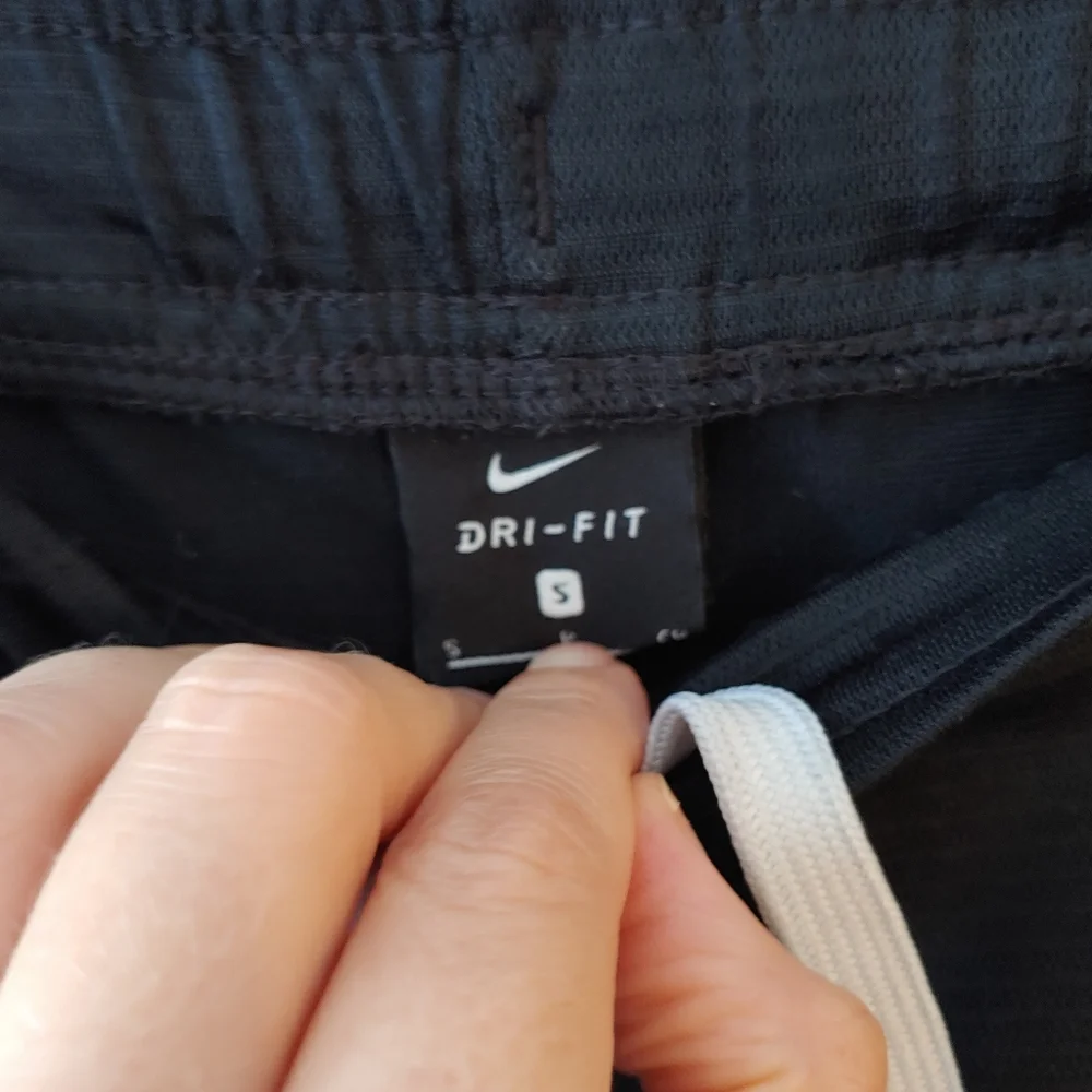 Nike Black Shorts with White Swoosh Size Small